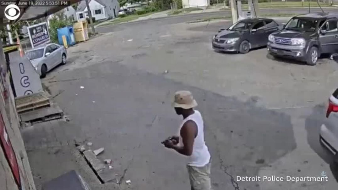 Father holding baby fends off man with gun at Detroit gas station