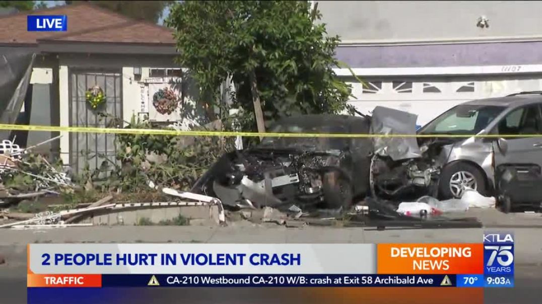 2 injured when car crashes into parked truck, lands on Los Angeles lawn