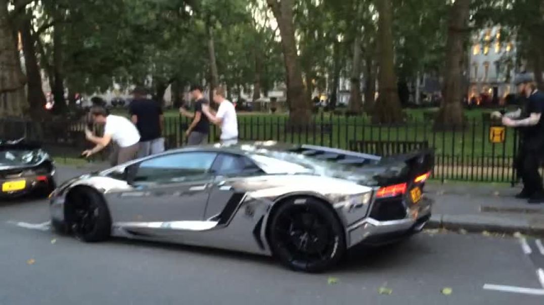 Chrome McLaren P1 and Aventador in London pulling away