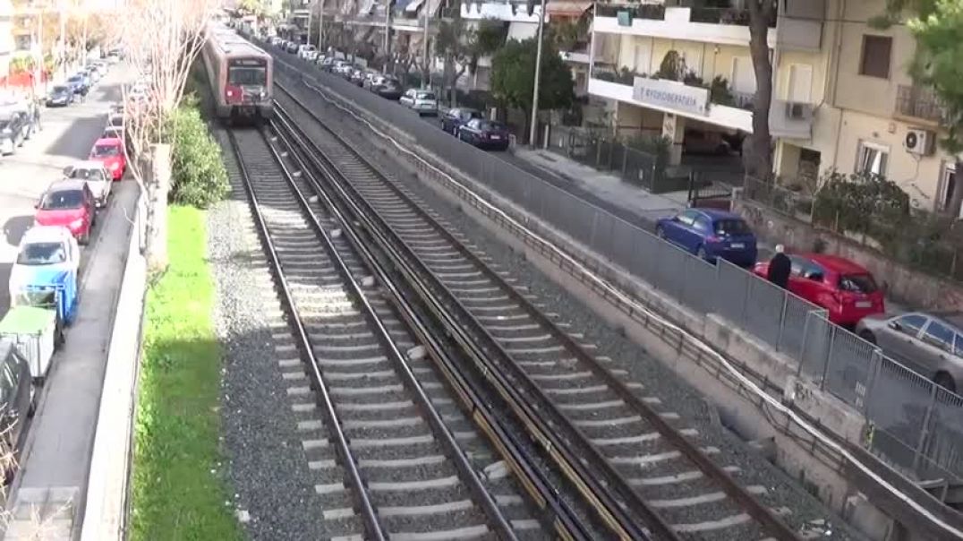 ⁣EMU trains of Athens Metro line 1 passing before and after Aghios Eleuftherios station