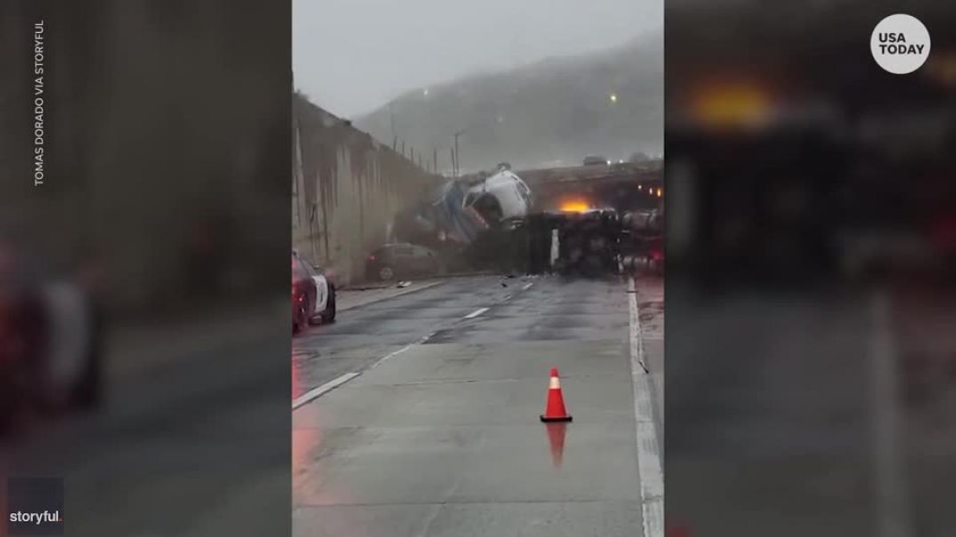 ⁣Two injured after a truck flips off an overpass and lands on another pile up in California