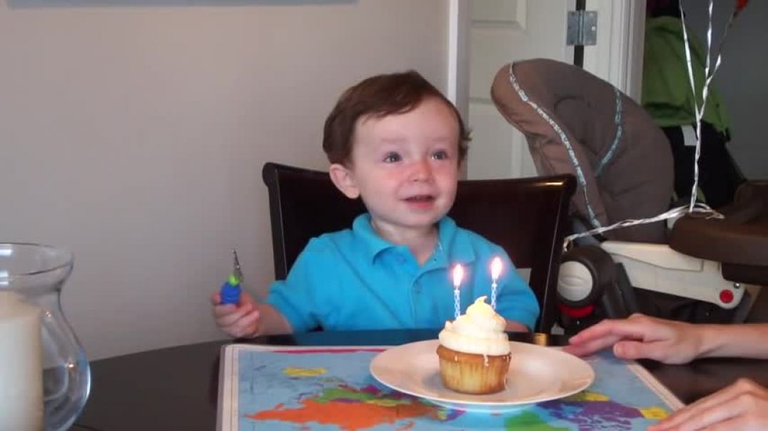 ⁣Mitchell blows out his birthday candles - 2 years old