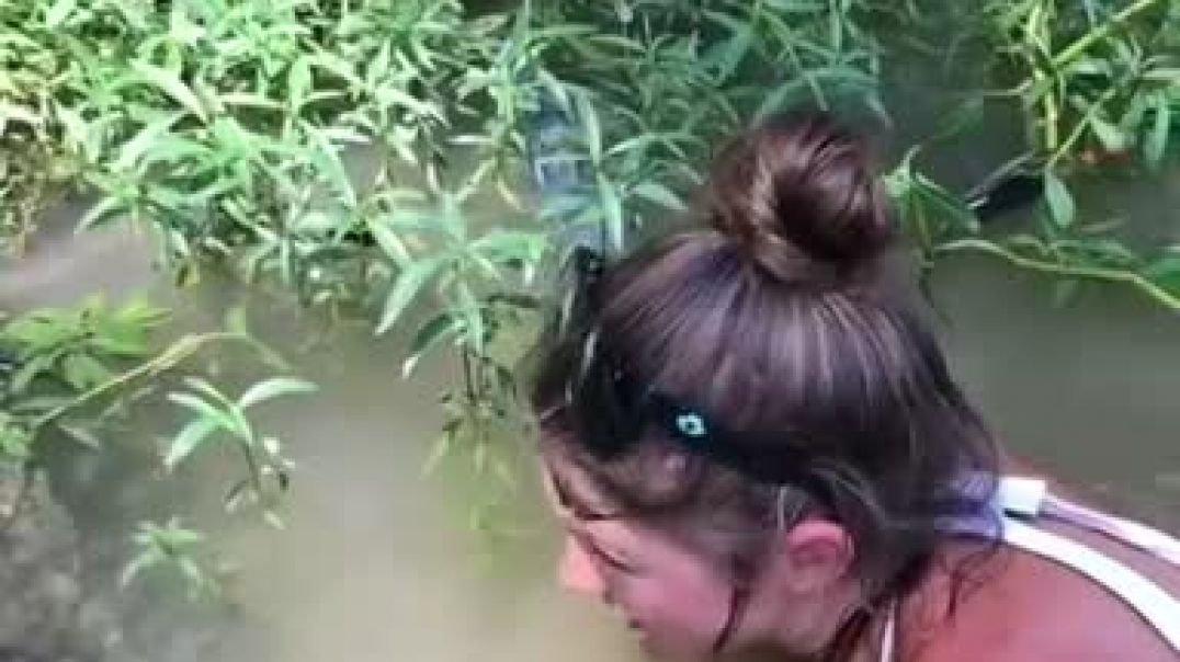 CATFISH NOODLING Girl Catches Huge Catfish With Her Hands! GET BIT