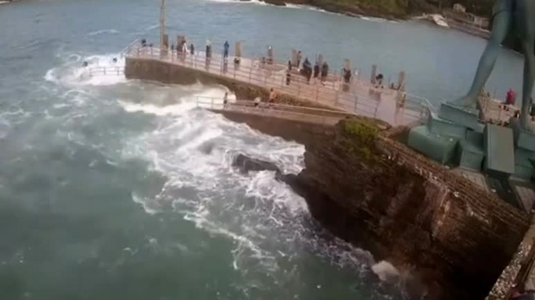 Terrifying moment girl gets swept into sea after being hit by wave