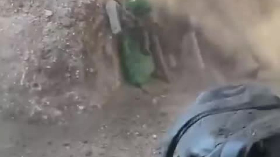 ⁣Ukrainian soldiers barely avoid Russian bomb as they hide in a trench