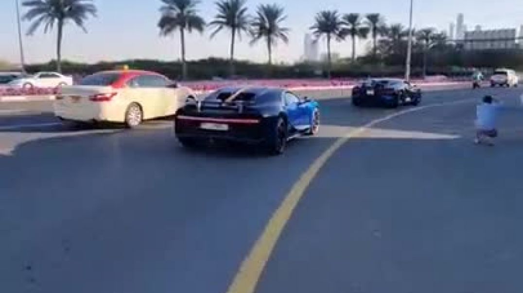 Guy brings both his Bugattis to a car show
