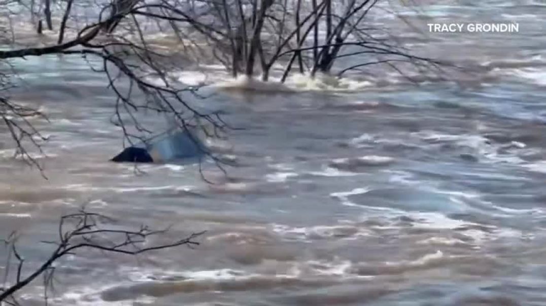 Casket appears to be floating down rapids on the Androscoggin River