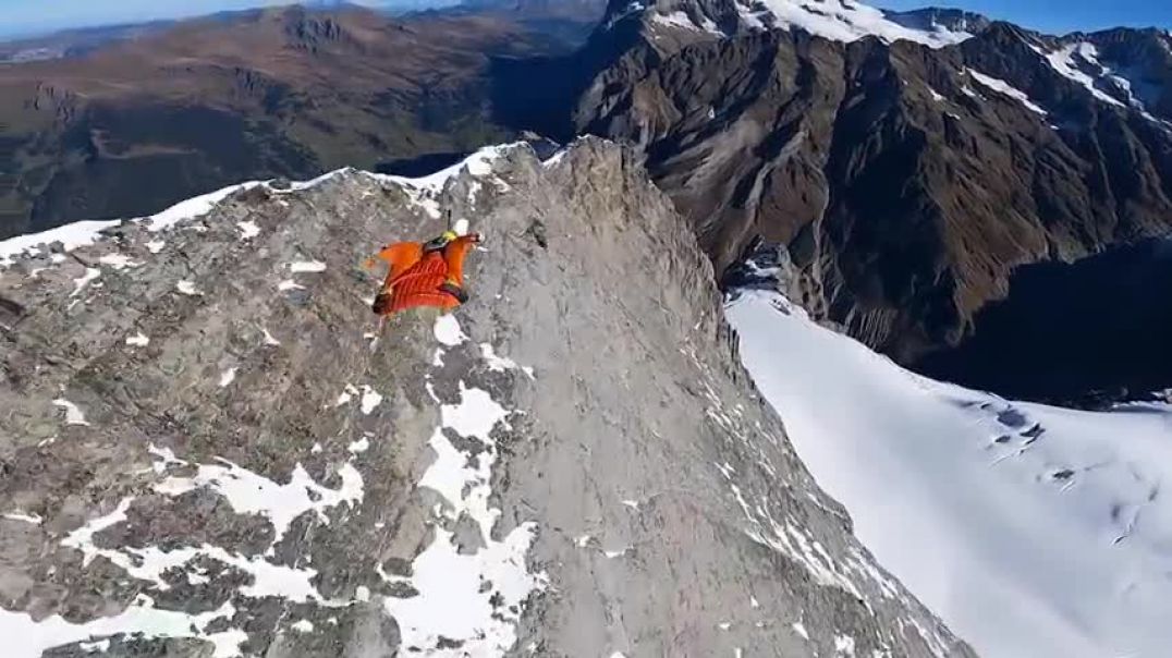 RidgeMonster.com Douggs WingSuit pilot flying Eiger Mountain Switzerland & cameraman Sam Hardy.