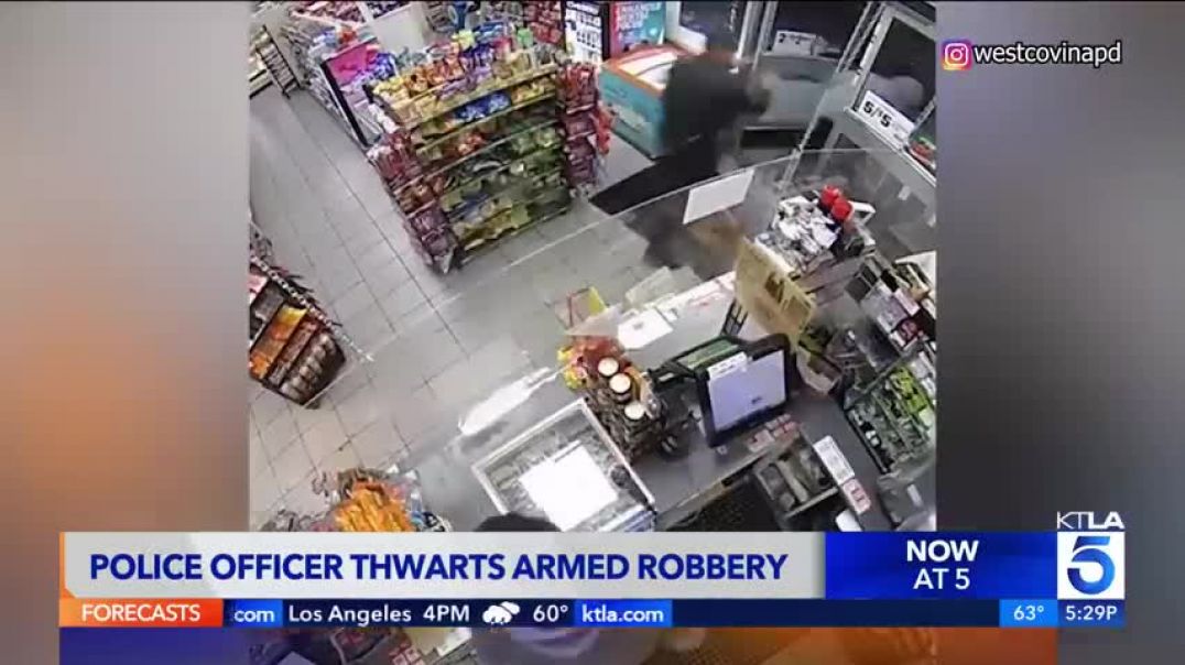 ⁣Video captures officer walking into 7-Eleven during armed robbery