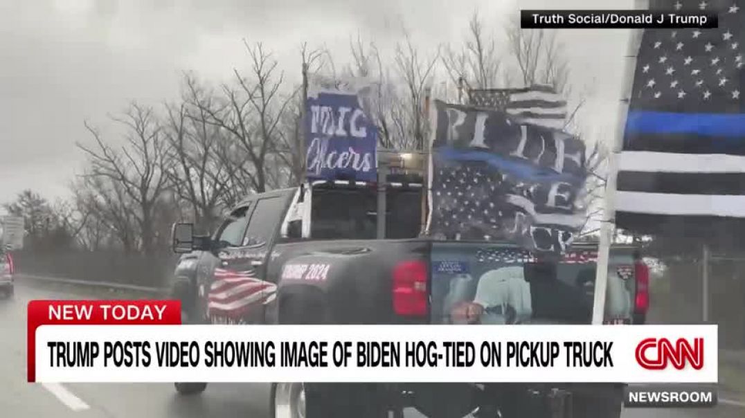 ⁣Trump posts video that shows image of Biden tied up in the back of a truck