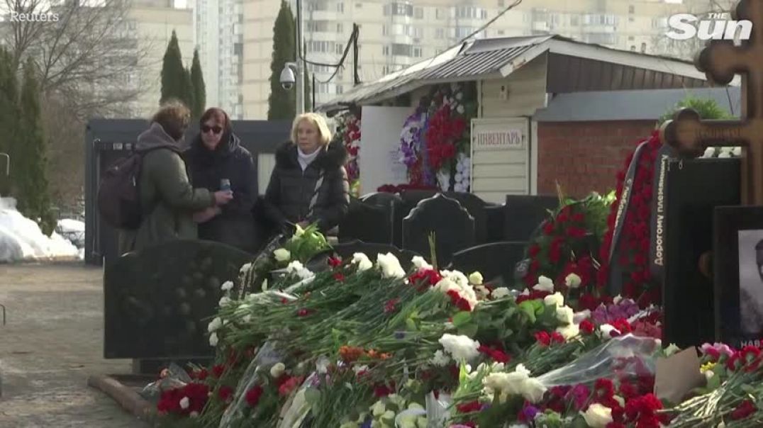 ⁣Alexei Navalnys mother visits her sons grave in Moscow as mourners continue to pay their respects