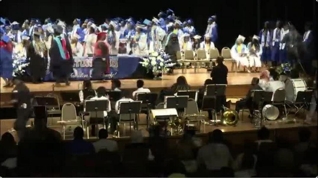 ⁣Fight breaks out at high school graduation